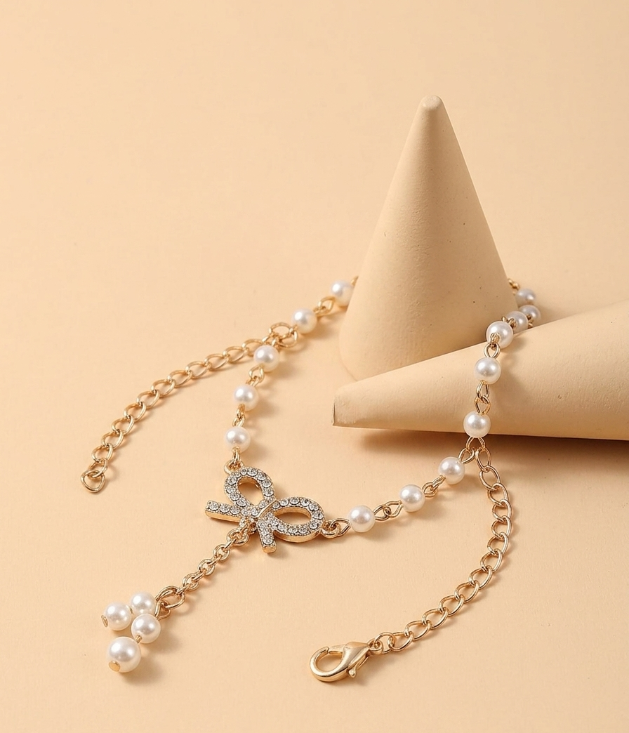 Gold Bow Pearl Bracelet – Elegant Crystal Knot Design | Adjustable Chain Jewelry for Women