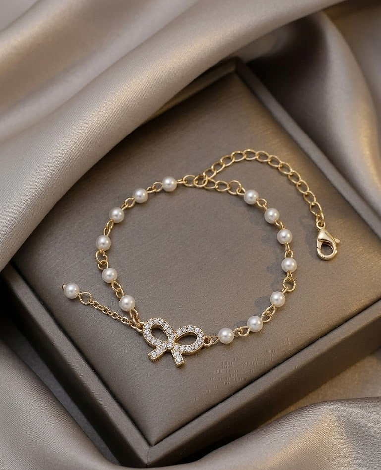 Gold Bow Pearl Bracelet – Elegant Crystal Knot Design | Adjustable Chain Jewelry for Women